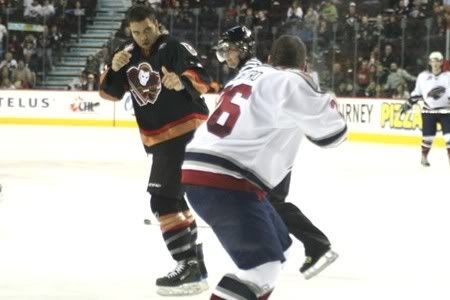 Blues' third-rounder Ian Schultz gets ready to throw down with Cody Castro of the Lethbridge Hurricanes