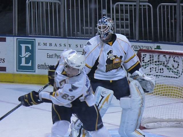 Chris Holt stands tall in the Rivermen nets as team captain and leader Trent Whitfield moves the puck out of danger ('St. Louis Game Time' photo by Brian Weidler)