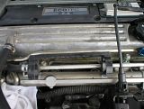 railbolts.jpg Remove the bolts holding on the fuel rail, as shown here (loosened bolt on the right, and left behind the fuel line) and unclip that black plastic bracket holding the metal line just above the fuel rail (not sure what it is) image by bc3tech