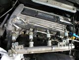 removerail.jpg Now using some coaxing, and moving of existing lines, you can take out the fuel rail and the injectors will come with it. do this carefully so as not to rip out other stuff that is in the immediate area. image by bc3tech